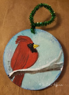 Cardinal on blue ornament